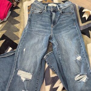 Ripped Blue Jeans buckle